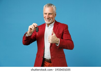 Funny Elderly Gray-haired Mustache Bearded Business Man Wearing Red Jacket Suit Standing Hold In Hand Car Keys Showing Thumb Up Looking Camera Isolated On Blue Color Wall Background Studio Portrait