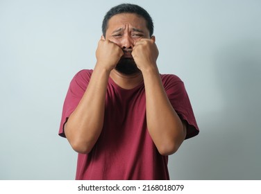 Funny Expression Of Young Asian Man Cry