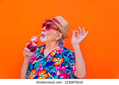 Funny And Extravagant Senior Man Posing On Colored Background - Youthful Old Man In The Sixties Having Fun And Partying