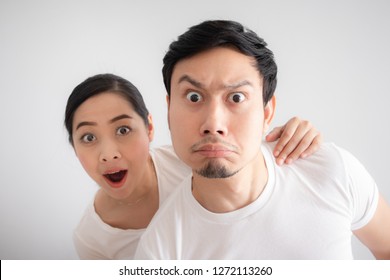 Funny Face Of Asian Lovers Couple In Doubt At An Unbelievable Thing That They Are Looking At