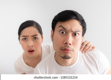 Funny Face Of Asian Lovers Couple In Doubt At An Unbelievable Thing That They Are Looking At