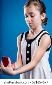 Funny Face Of A Disgusted Girl Receiving An Unwanted Gift