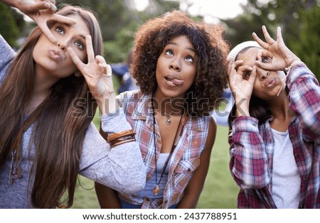 Funny, face and friends in a park with silly, fun or bonding on vacation, weekend or reunion in nature. Crazy, expression and gen z women in a forest with goofy, comic or personality, joke or gesture