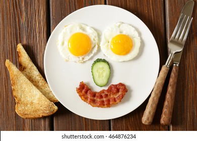 Funny Face Serving Breakfast, Fried Egg And Toast  