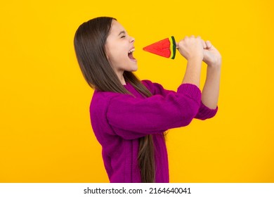 Funny Face. Teen Girl Hold Lollipop Caramel On Yellow Background, Candy Shop. Teenager With Sweets Suckers.