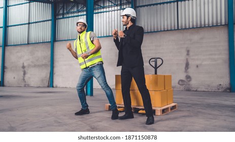 Funny factory workers dance in the factory . Happy people at work . - Powered by Shutterstock