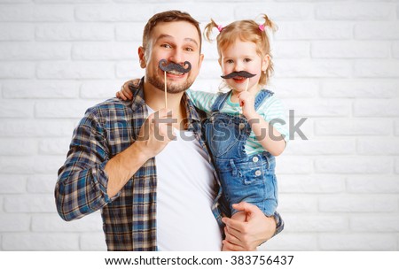 funny family father and child daughter with a mustache
