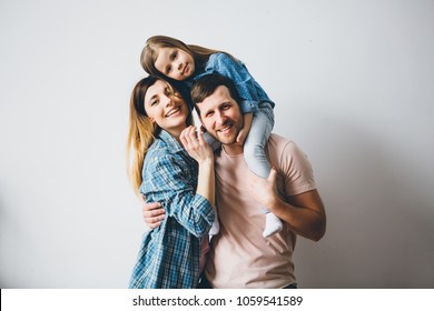 Funny Family Photo On Grey Background.