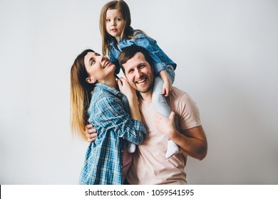 Funny Family Photo On Grey Background.