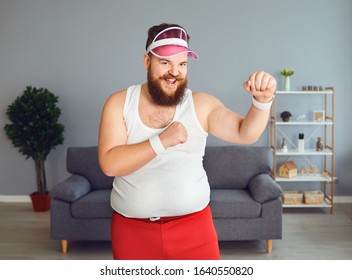 Funny Fat Boxer In Sportswear Is Boxing In The Room.