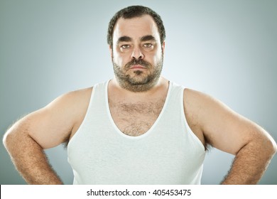 funny fat macho man isolated on grey
