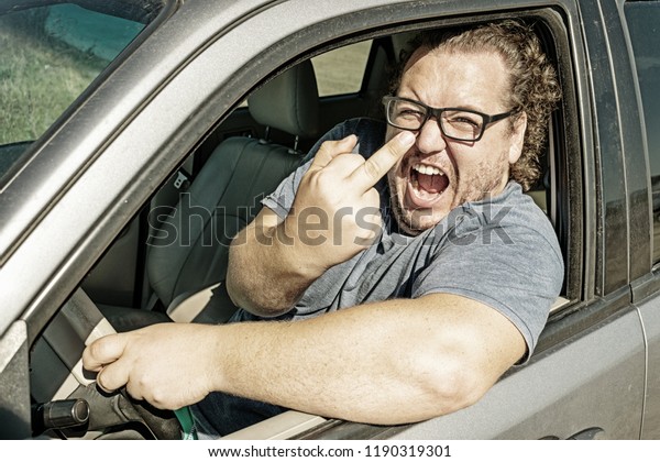 Funny fat man in the\
car. Road and stress