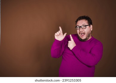 Funny fat man posing in studio on brown background. Different emotions.