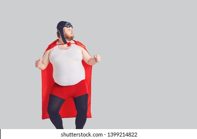 Funny Fat Man In A Superhero Costume Dancing