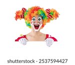 Funny female clown peeking out from behind sign blank template mock up for advertising, posters, greetings, invitations. Entertainer as Joker in a suit and wig, with clown whiteface makeup.