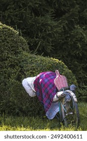 A funny figurine  was made from straw and corn stalks. It is a subject for exterior decoration. Fun attraction for passers-by.