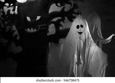 Funny ghost and creepy tree as decor for Halloween party