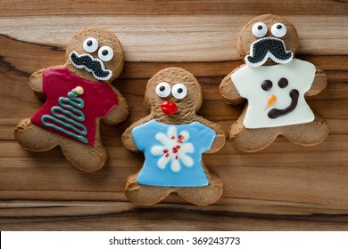 Funny Gingerbread Cookies Wearing Ugly Holiday Sweaters And Eyes And A Mustache