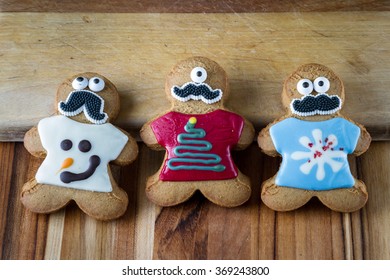 Funny Gingerbread Cookies Wearing Ugly Holiday Sweaters And Eyes And A Mustache