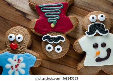 Funny Gingerbread Cookies Wearing Ugly Holiday Sweaters And Eyes And A Mustache