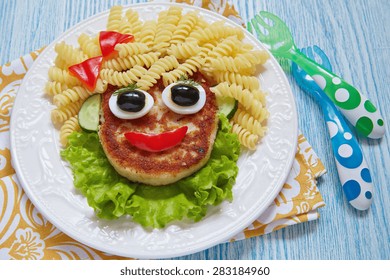 Funny Girl Food Face With Cutlet, Pasta And Vegetables