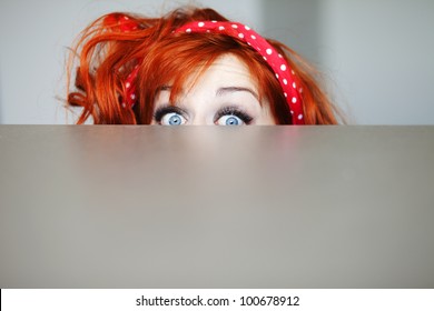 Funny Girl Hiding Behind A Table