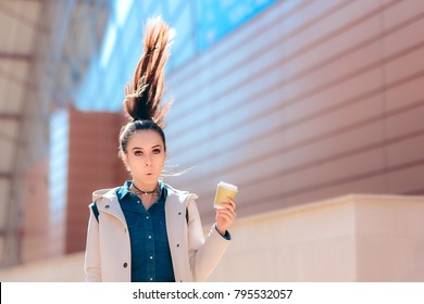 Funny Girl with Hot Drink Coffee Cup For Extra Morning Energy
Hilarious portrait of a young woman experiencing caffeine effects 
