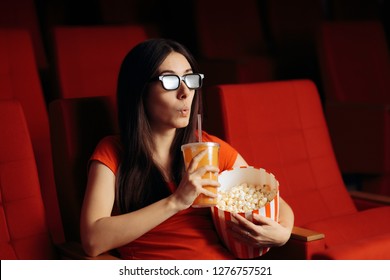 Funny Girl with Popcorn Watching 3D Movie in Cinema Theater. Film fan watching entertaining flick and snacking 
