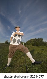 Funny Golfer Leaning On Golf Club Enjoying The Sun.