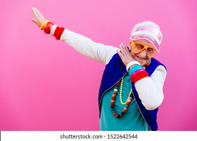 Funny grandmother portraits. 80s style outfit. Dab dance on colored backgrounds. Concept about seniority and old people - Shutterstock ID 1522642544