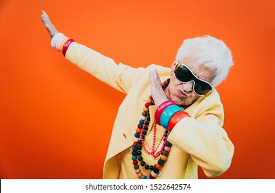 Funny grandmother portraits. Senior old woman dressing elegant for a special event. granny fashion model on colored backgrounds