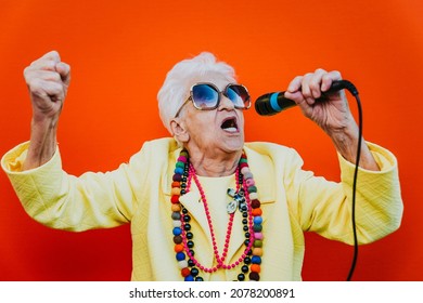 Funny Grandmother Portraits. Senior Old Woman Dressing Elegant For A Special Event. Rockstar Granny On Colored Backgrounds