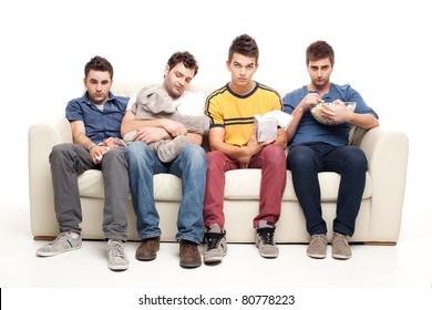 Funny Group Of Young Men Watching Sad Movie Sitting On A Couch