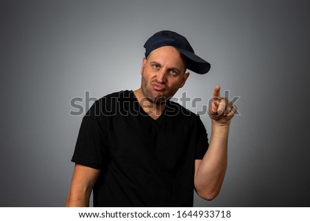 funny guy in black shirt with backwards hat