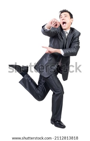 Funny guy gesturing and running in studio