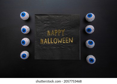 Funny Halloween treat - Candy eyeballs with a Napkin written 
