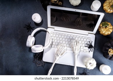 Funny Halloween Workplace With Laptop Flat Lay. Office Corporation Halloween Party Invitation, Blogger Autumn Holiday Background. White Laptop With Halloween Party Decor, Black Background Top View