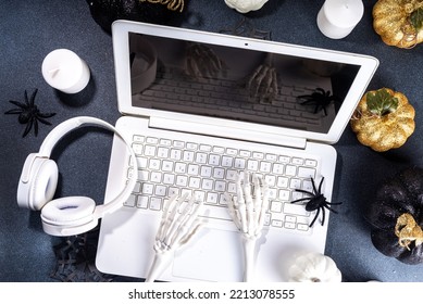 Funny Halloween Workplace With Laptop Flat Lay. Office Corporation Halloween Party Invitation, Blogger Autumn Holiday Background. White Laptop With Halloween Party Decor, Black Background Top View