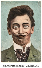 funny handsome man with crazy smile. vintage aged paper picture Fool's Day