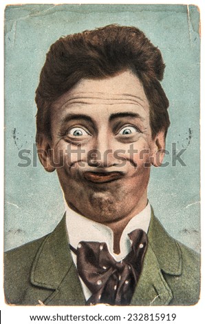 funny handsome man with crazy smile. vintage aged paper picture Fool's Day