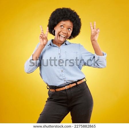Funny, happy and black woman with peace sign, smile and girl against a studio background. African American female, lady and gesture for chill, goofy and silly with joy, cheerful and positive mindset