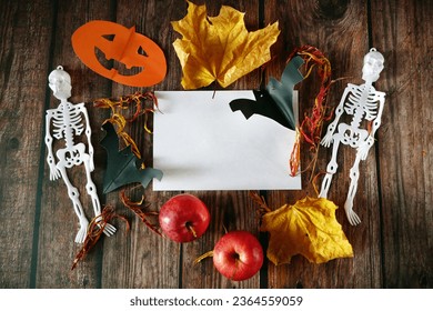 Funny happy halloween skeleton and pumpkin Jack O Lantern. Halloween festive for banner, poster, greeting card, party invitation on black, the day of the Dead, closeup 