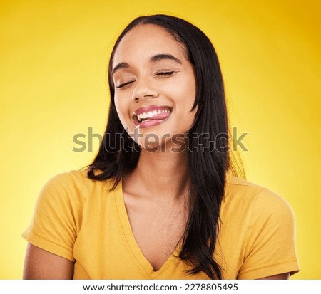 Funny, happy and woman with tongue out, silly and cheerful on studio background. Comic, female and lady with happiness, goofy and facial expression with joy, amusing and humor face with crazy gesture