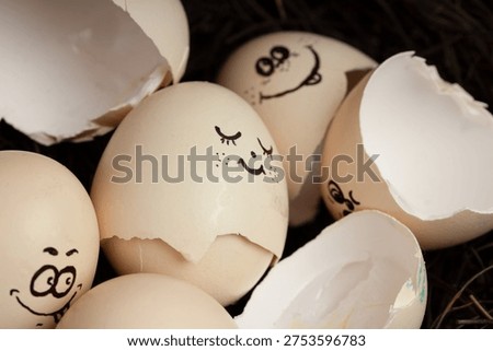Funny hatching egg characters with smiling faces and eggshells.  Anthropomorphic concept representing birth, new beginnings, Easter celebration and the joy of life. 