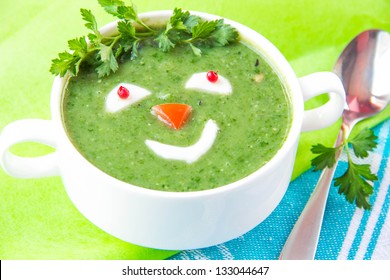 Funny healthy soup with spinach for children