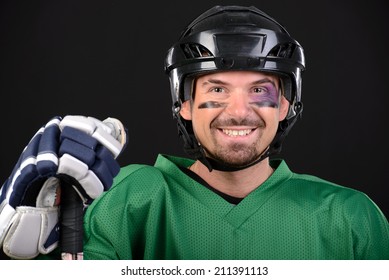 Funny Hockey Player Smiling, Bruise Around The Eye. Black Background