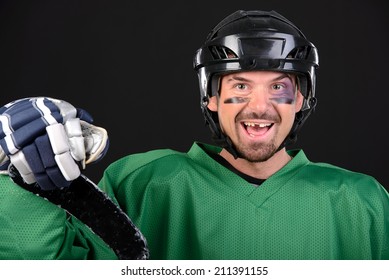 Funny Hockey Player Smiling, Bruise Around The Eye. Black Background