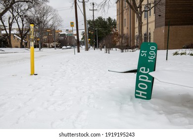 Funny image of a Hope Street sign fallen to the ground during the winter 2021 storm in Dallas Texas
