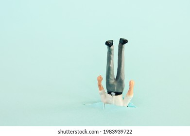Funny image of man stuck upside down