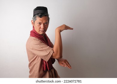 funny indonesian muslim man taking a stance - Shutterstock ID 2226072781